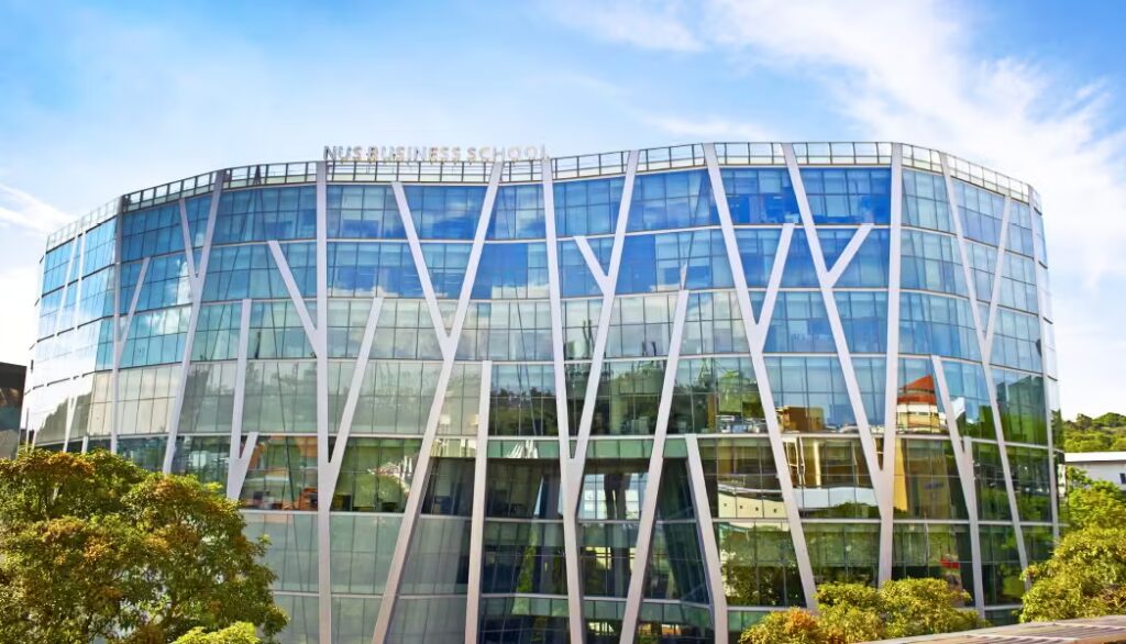 Exterior of the curved glass NUS Business School building; the NUS MSBA is run jointly by the business school and the school of computing